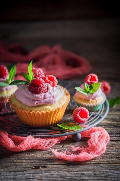 Homemade raspberry muffin made of cream and fruits