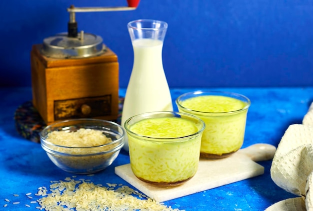 Homemade Rice Pudding with Caramel and bottle milk and coffee grinder