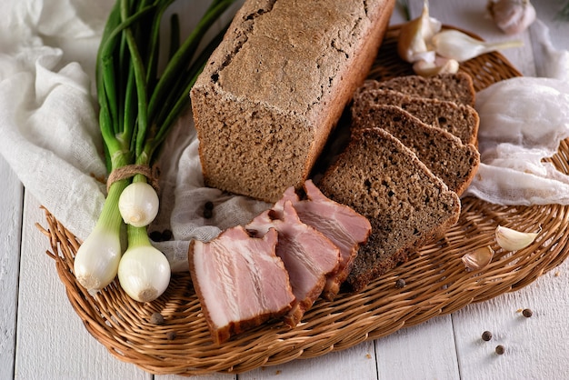 Homemade rye bread for breakfast with meat and onions