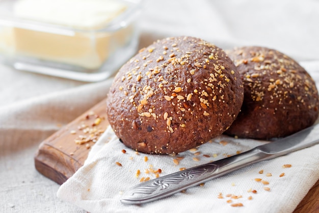 Homemade rye buns with linseeds, sesame and white poppy seeds