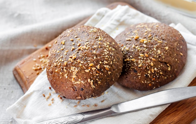 Homemade rye buns with linseeds, sesame and white poppy seeds