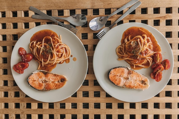 Homemade salmon spaghetti with tomato sauce for lunch