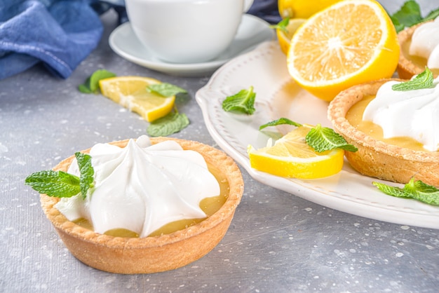 Homemade shortbread mini tart cakes with lemon curd and whipped cream 