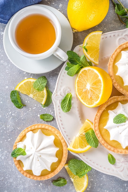 Homemade shortbread mini tart cakes with lemon curd and whipped cream 