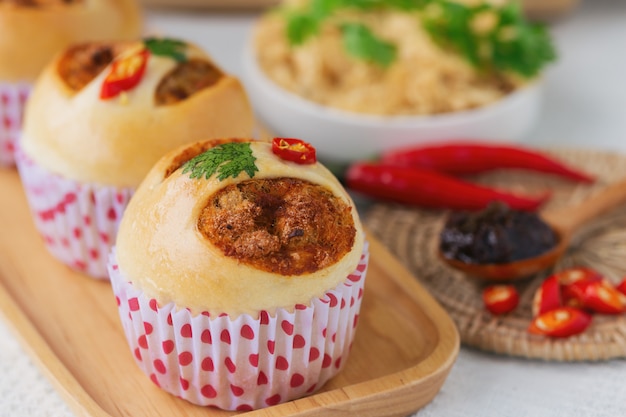 Homemade soft and sticky bun with dried shredded pork or pork floss and shrimp roasted chili paste.