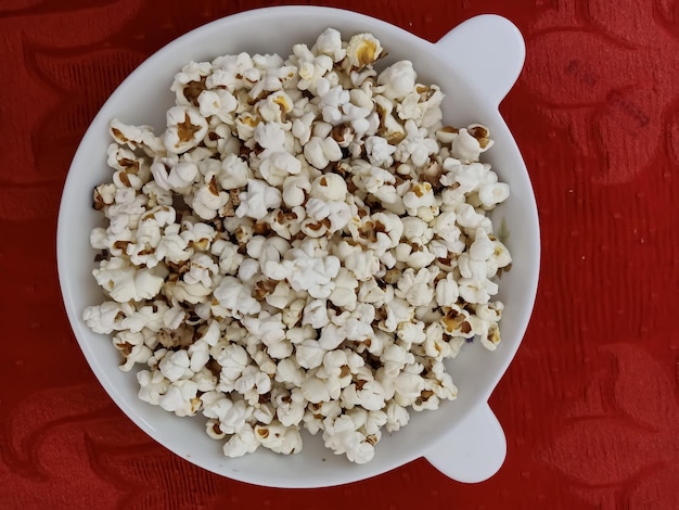 Homemade special popcorn. Valentine's day homemade special food. Arrange the popcorn on the plate.