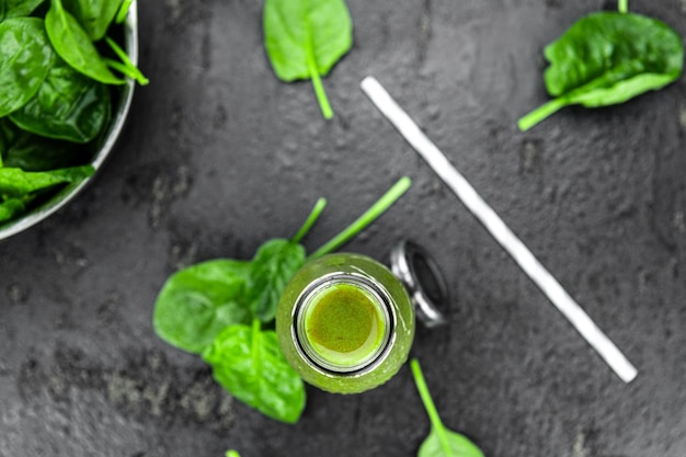 Homemade spinach smoothie close up selective focus