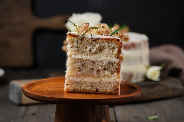 Homemade sponge cake with cream cheese cream and white currant filling