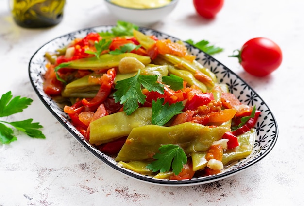 Homemade stewed green beans tomatoes garlic with olive oil Zeytinyagli fasulye traditional food Turkish cuisine