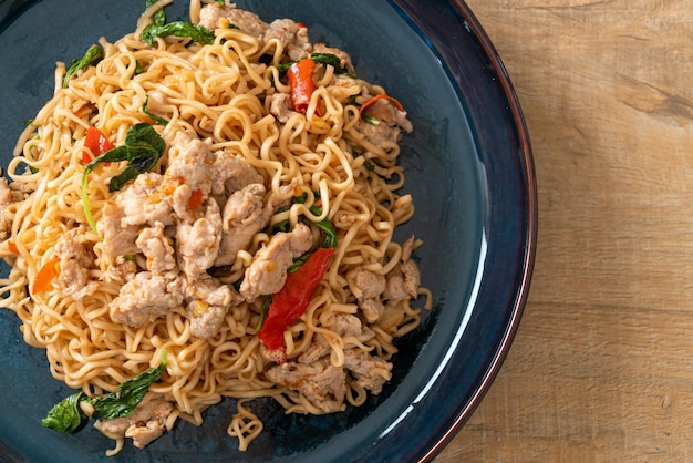 homemade stir-fried instant noodles with Thai basil and minced pork - Thai food style