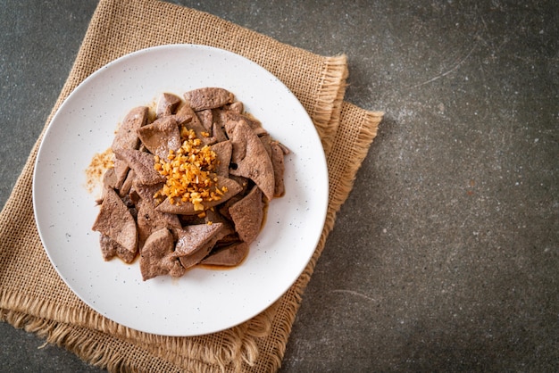 Homemade stirfried pork liver with garlic on plate