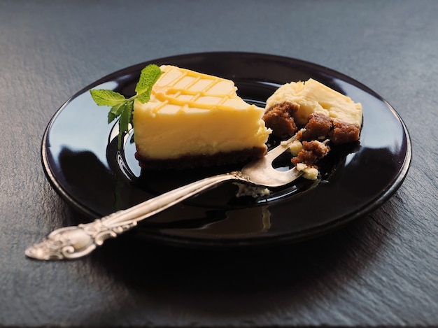 Homemade vanilla cheesecake and mint leaves for dessert