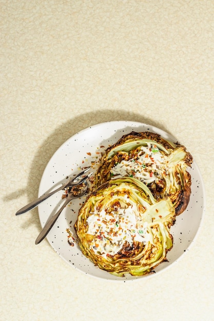 Homemade vegan cabbage steaks with herbs spices and sauce Healthy food ready to eat