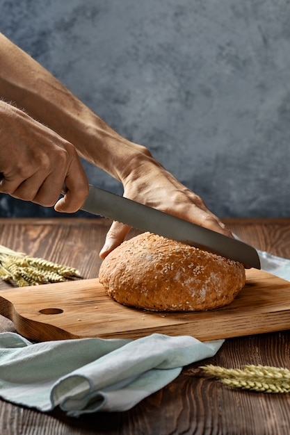 Homemade wheat bread on wooden cutting board