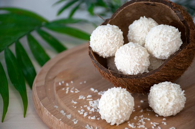 Homemade white chocolate candies in coconut flakes in nut shell