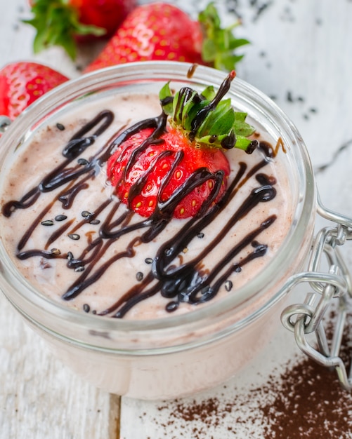 Homemade yogurt in a jar with strawberry