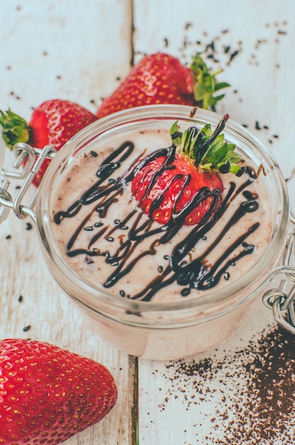 Homemade yogurt in a jar with strawberry