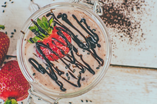 Homemade yogurt in a jar with strawberry