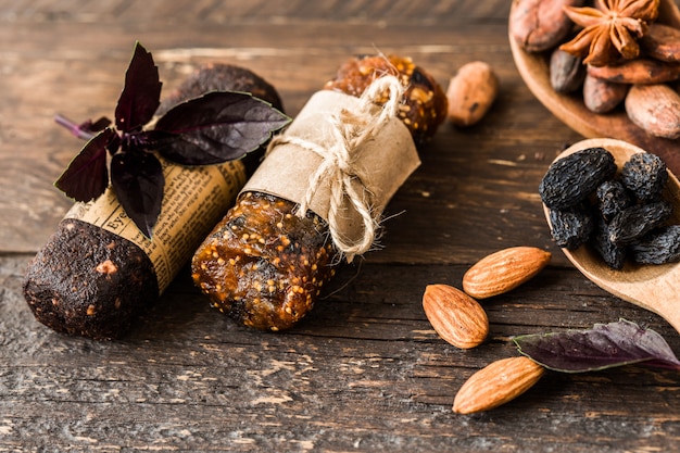 Honey bars with peanuts, sesame and sunflower seeds Caramel nuts. Snacks of seeds, nuts and sesame seeds with honey on a wooden background. Sugared nuts.