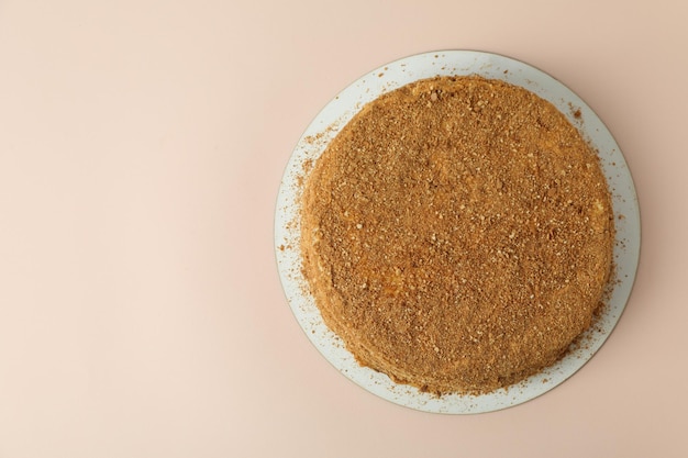 Honey cake on beige background space for text