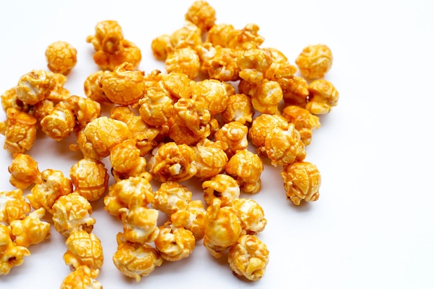 Honey caramel popcorn on white background