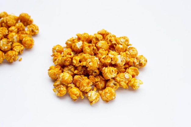 Honey caramel popcorn on white background