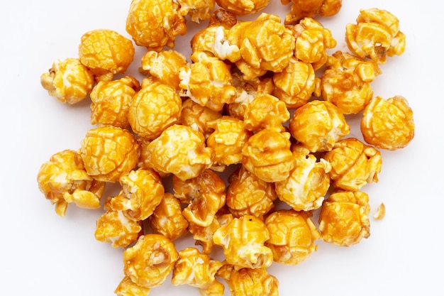 Honey caramel popcorn on white background