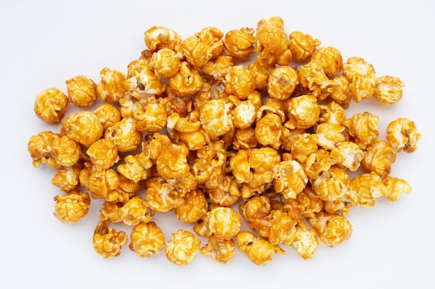 Honey caramel popcorn on white background