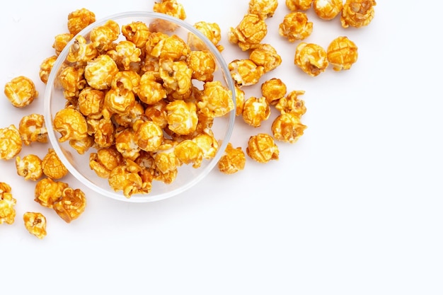 Honey caramel popcorn on white background