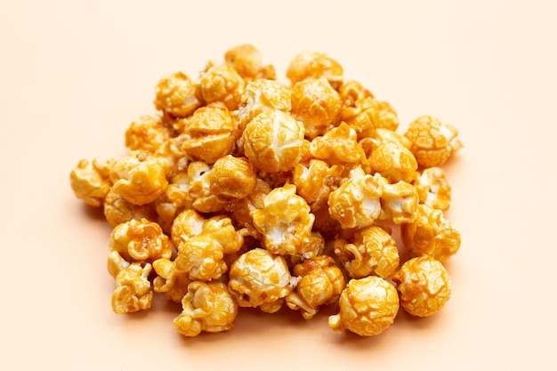 Honey caramel popcorn on yellow background