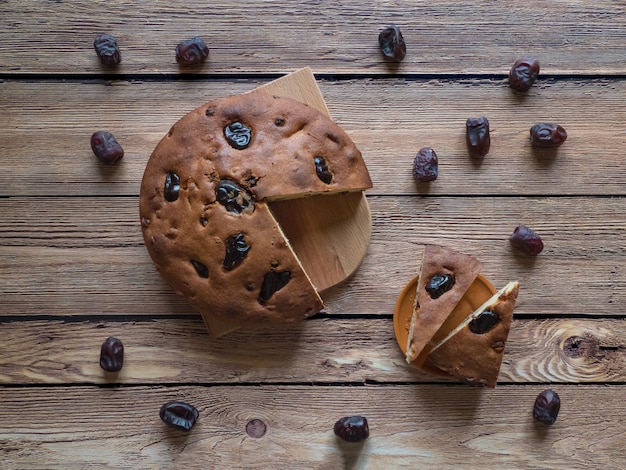 Honey and date cake on a wooden surface