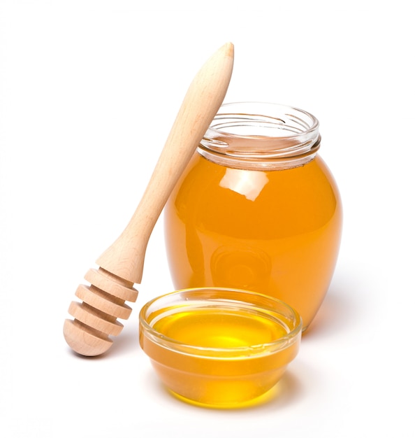 Honey dipper and honey in jar 