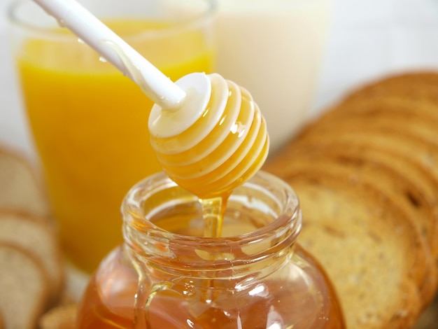 Honey dripping from a spoon