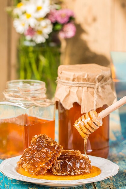 Honey in a pot or jar on kitchen table