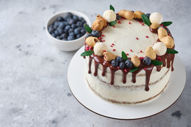 honey sponge cake with salted caramel and peanuts cake with cream cheese cream and peanut butter