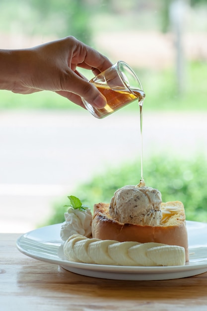 Honey toast with ice cream and sliced banana