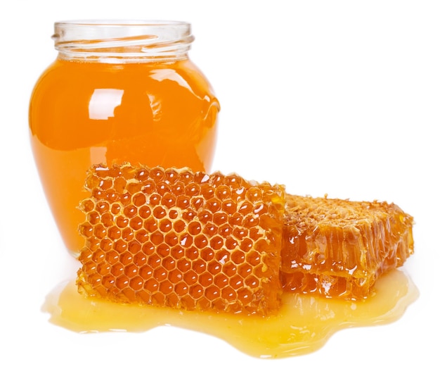 Honey with honeycomb isolated on white background