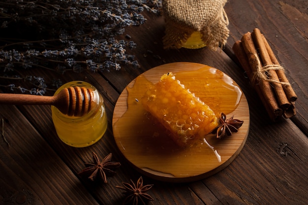 Honey on wooden background.