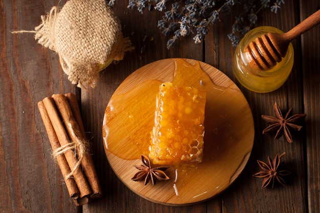 Honey on wooden background.