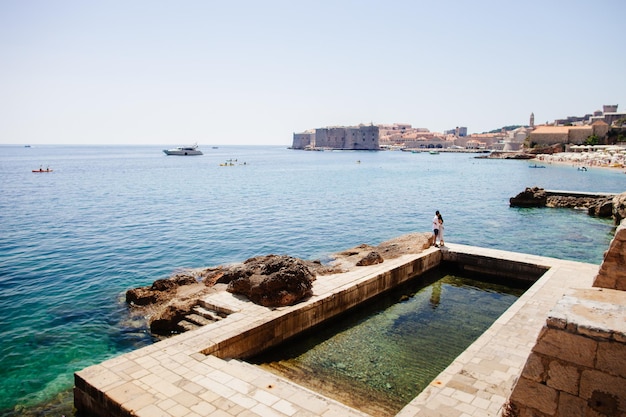 Honeymoon couple  on vacation in Europe with sea view Hands together back view Dubrovnik