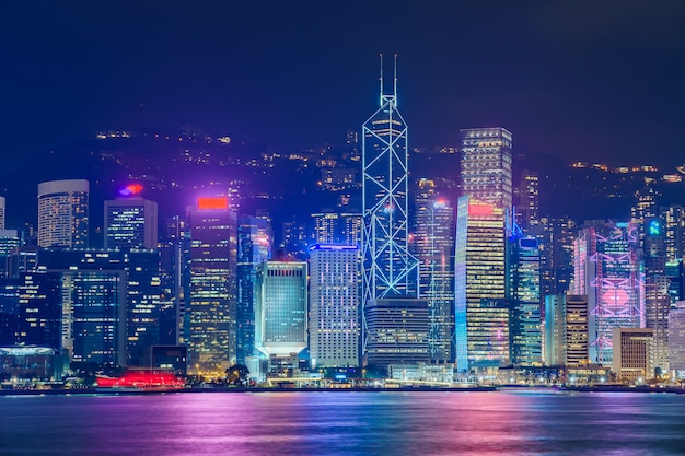 Hong Kong skyline cityscape downtown skyscrapers over Victoria Harbour in the evening. Hong Kong, China