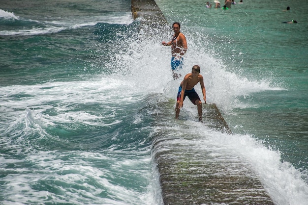 HONOLULU, USA - People having fun at waikiki beach