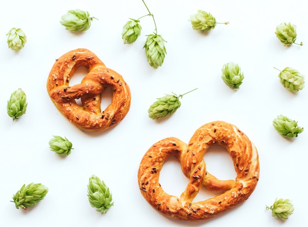 hop cones and pretzels on a white isolated background. 