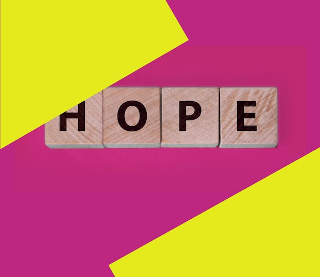 Photo hope word made on wooden cubes on blue healthcate and lifestyle concept