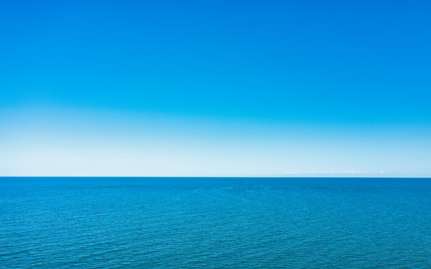 Horizon line blue sky and blue sea Drone view