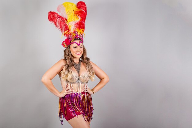 Horizontal half body shot beautiful Brazilian woman in carnival clothes smiling