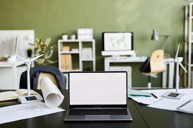 Horizontal image of laptop with empty display on table of architect at modern office