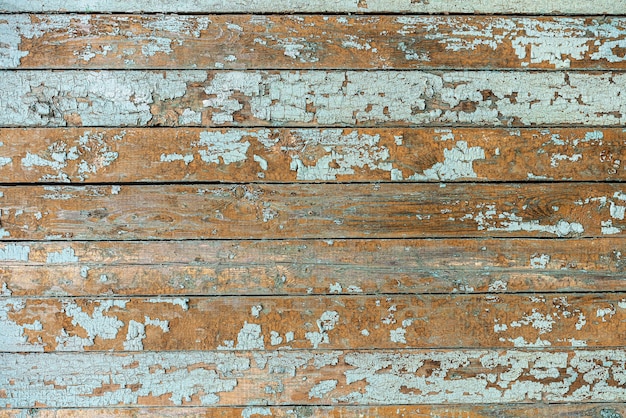 Horizontal old boards with peeling paint