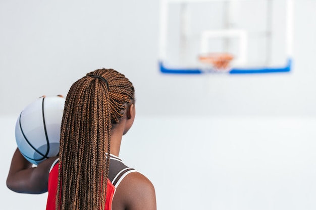 Horizontal photo female basketball player aiming for a shot Sport concept