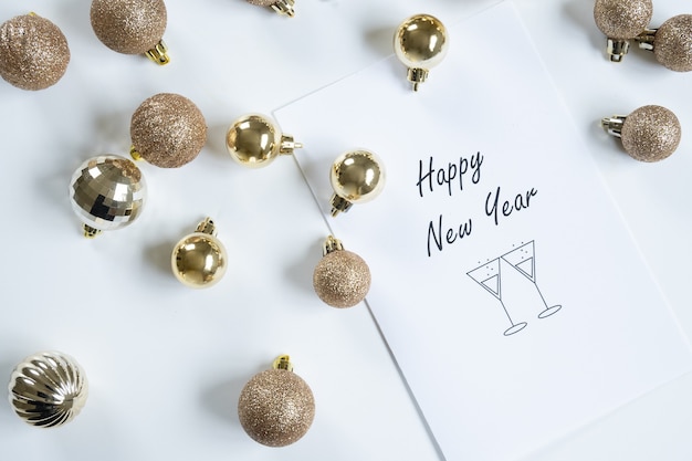 Horizontal top view of happy new year card, white background and copy space.